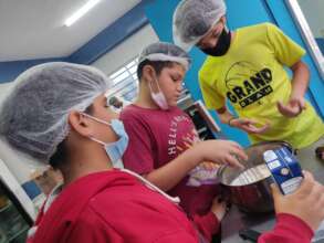 Our children taking cooking classes