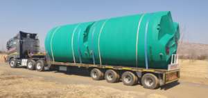Water tanks in transport to Mwandi