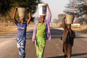 Women carrying water from Zambezi River
