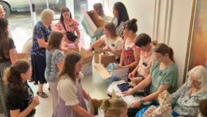 Coming together to make baby boxes for new moms