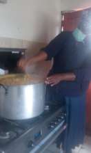 Nomfuneko cooking for her community