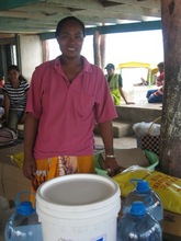 Fiataua Loto receiving aid