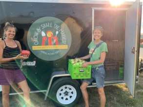 Our dedicated staff loading the trailer of produce