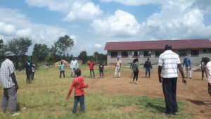 Tumaini staff conducting field life skills lessons