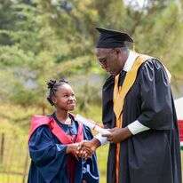 A young lady graduating from Tumaini