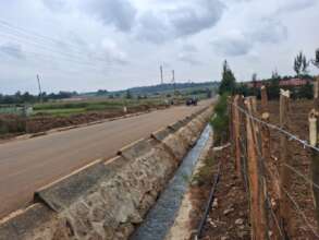 Bitumen road along the fence now complete