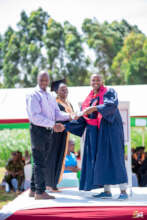 a graduand receiving his certificate