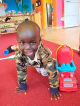 A baby playing in the daycare space