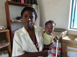 Health care worker with child holding CycleBeads