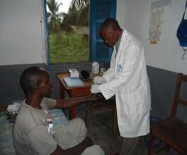 Innocent performing a test at Ndofia health center