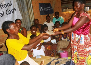 VSLA member receiving her savings