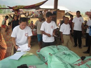 SEDA staff distributing rice and salt