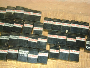 Batteries labeled with each household's name