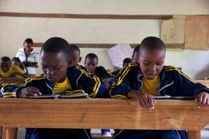 Students at Upendo school with e-readers