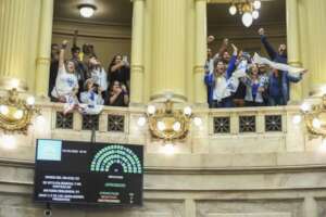 Canales celebrating the voted law at the Congress