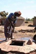 Villager draws water from a sanitized well