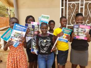 Young Ladies Receiving Test Prep Study Guides