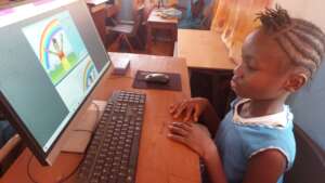 Aminata reading "Colors of the Rainbow"