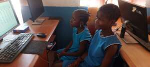 Danella and Hawa practicing PowerPoint skills