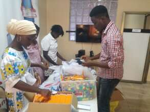 DASL Team & Volunteers packing the pencil pouches