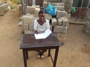 Aminata at her new desk