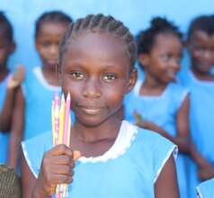 FAWE student with her new pencils