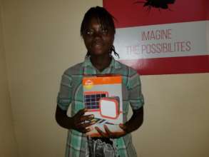 Fatmata with her new solar light