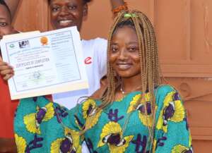 Grace with her computer training certificate
