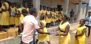 Students receiving their notebooks