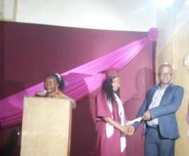 Mbalu receiving her diploma