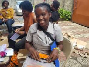 Yealie helping pack the pencil pouches