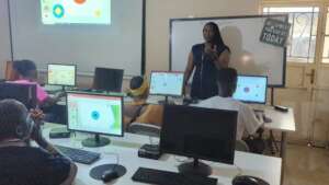 Miss Aminata talking to the Computer Lab Students