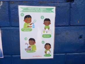 Handwashing signs are set up around the school