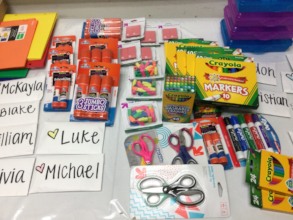 donated school supplies with letters