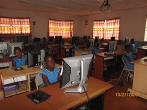 Girls eagerly learning in computer lab