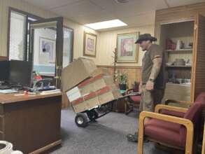 UPS driver dropping off boxes of donated supplies