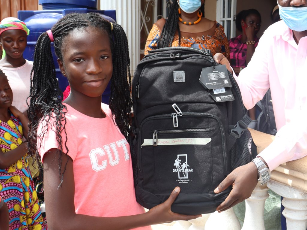 Abigail receiving School Supplies