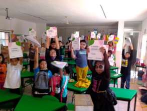 Students with their workbooks