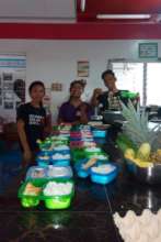 Youth volunteers helping pack the baon