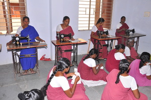 Women stitching their blouses