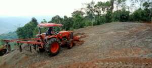 Barren hillside plowed to prepare to reforest