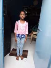 Poonam in her doorway