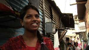 Kalpana outside her house