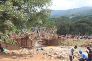 Zimbabweans crossing a makeshift bridge