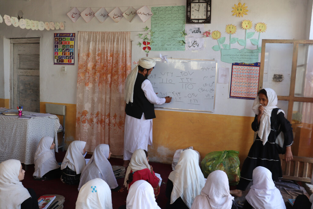Afghan girls studying mathematics in class