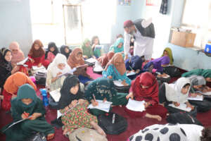 Girls learning together in a community classroom