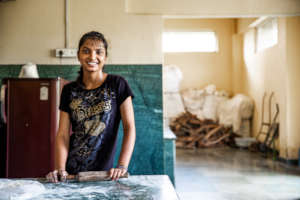 Coreena waiting for the kitchen classroom.