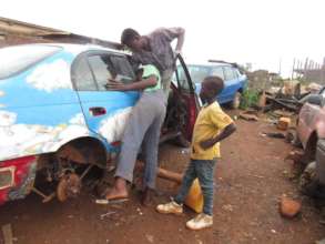 Nebimi working at a garage