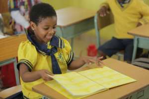 Child enjoying book in class