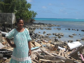 Fiataua Loto next to what was once her home